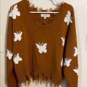 Brown V-Neck Sweater with White Butterfly Pattern